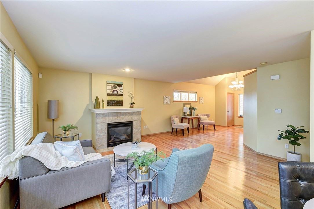 2324 194th Street Southeast Bothell, WA 98012 - Photo 6 of 22 a living room with furniture and a fireplace
