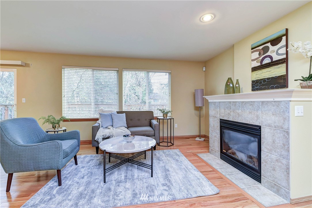 2324 194th Street Southeast Bothell, WA 98012 - Photo 7 of 22 a living room with furniture and a fireplace