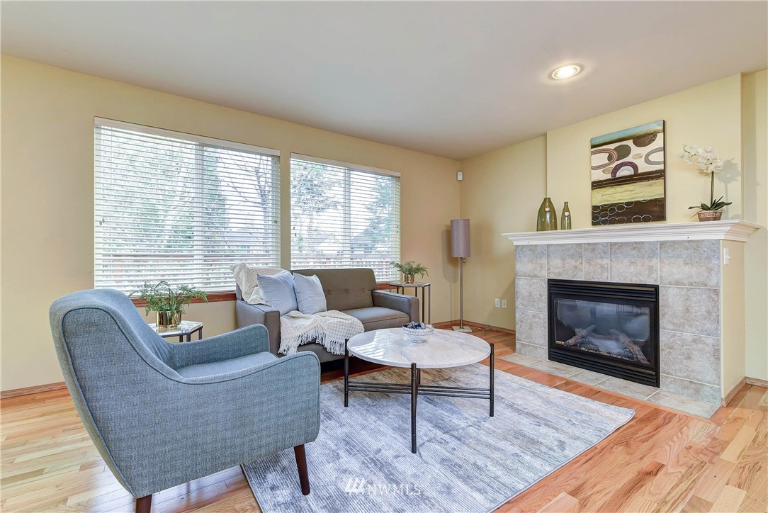 2324 194th Street Southeast Bothell, WA 98012 - Photo 8 of 22 a living room with furniture and a fireplace