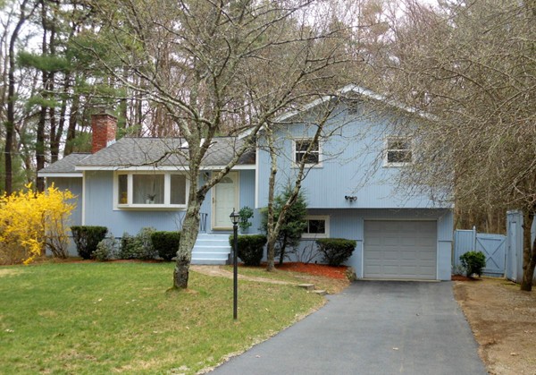 64 Hemlock Road Sudbury, MA 01776 - Photo 1 of 17 a front view of a house with a garden