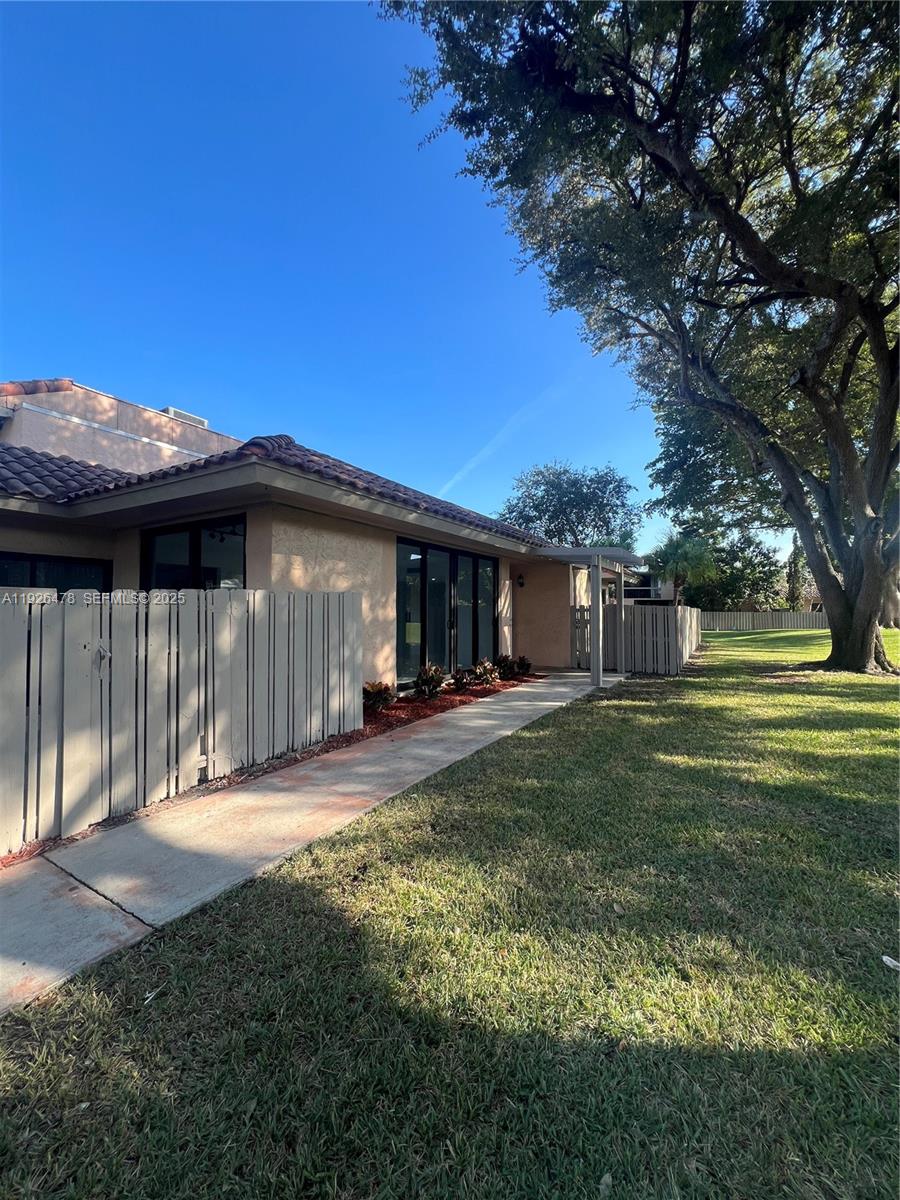20610 Northeast 7th Court Miami, FL 33179 - Photo 1 of 38 a view of a house with backyard and sitting area