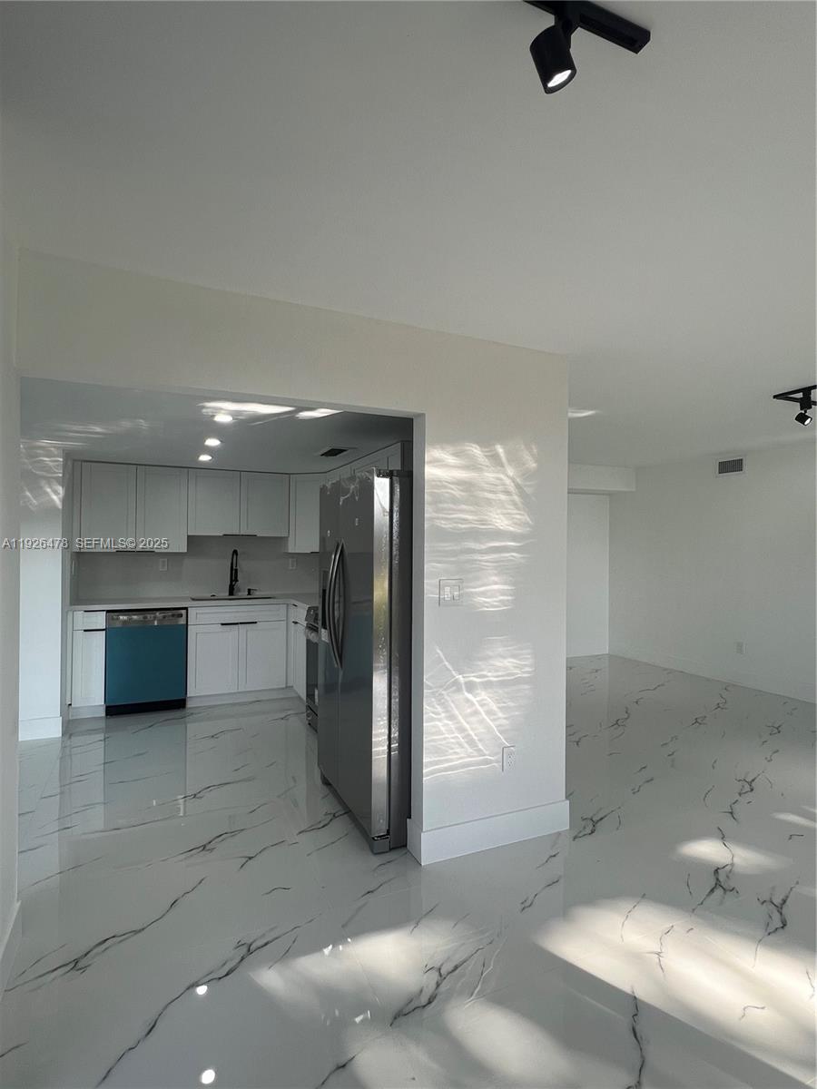 20610 Northeast 7th Court Miami, FL 33179 - Photo 12 of 38 a bathroom with a sink and a mirror