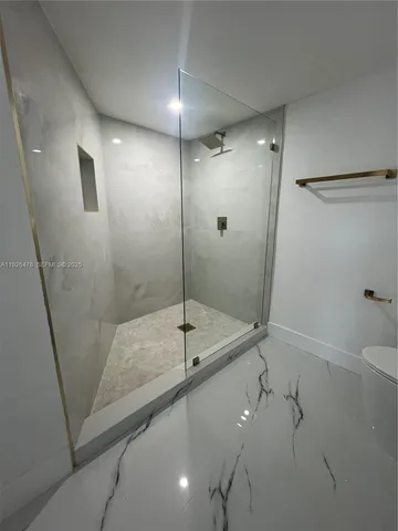 a view of a room with white walls