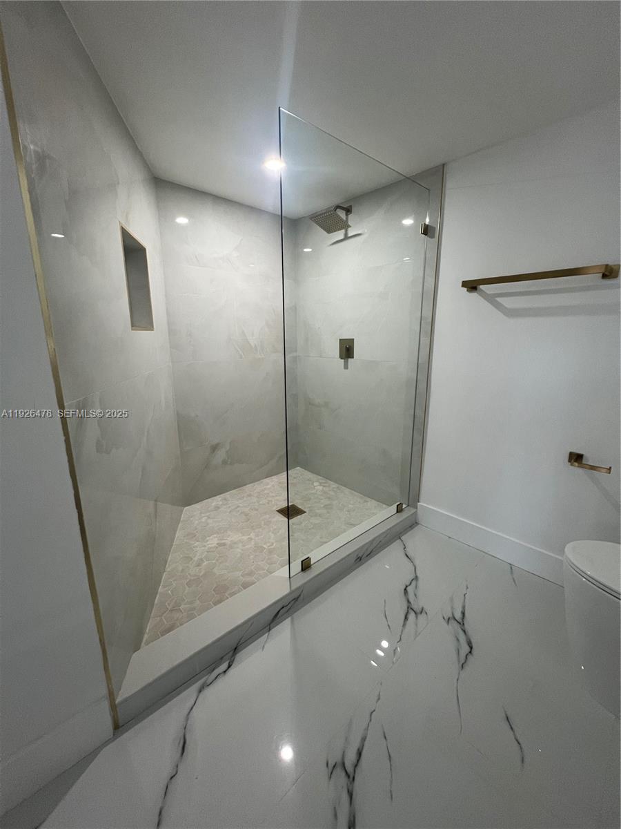 20610 Northeast 7th Court Miami, FL 33179 - Photo 14 of 38 a bathroom with a shower and a sink