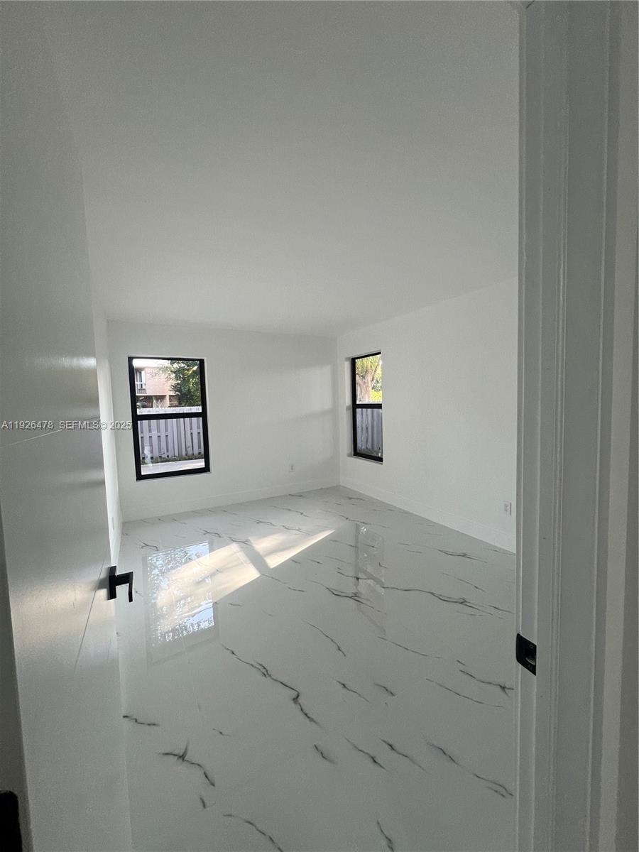 20610 Northeast 7th Court Miami, FL 33179 - Photo 21 of 38 a view of an empty room