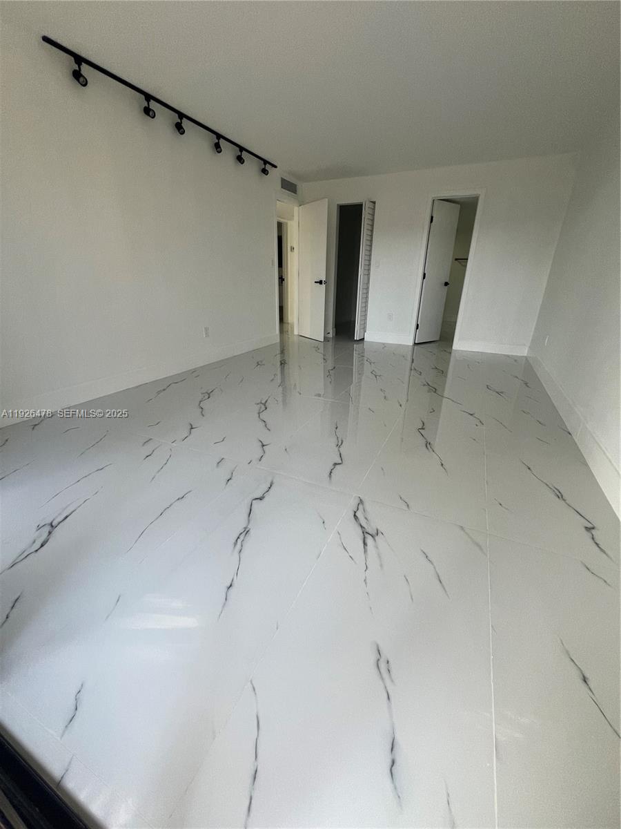 20610 Northeast 7th Court Miami, FL 33179 - Photo 28 of 38 a view of a room with white walls