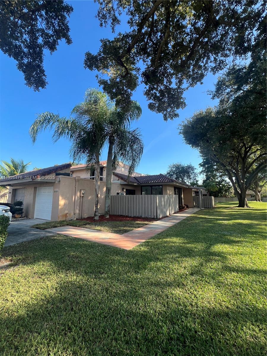 20610 Northeast 7th Court Miami, FL 33179 - Photo 3 of 38 a big yard with palm trees