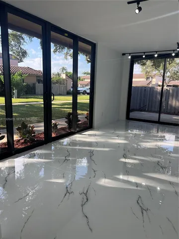 a kitchen with a refrigerator a stove top oven a sink and dishwasher
