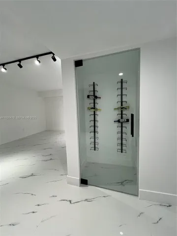 a bathroom with a shower and a sink