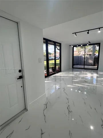 a spacious bathroom with a double vanity sink and mirror