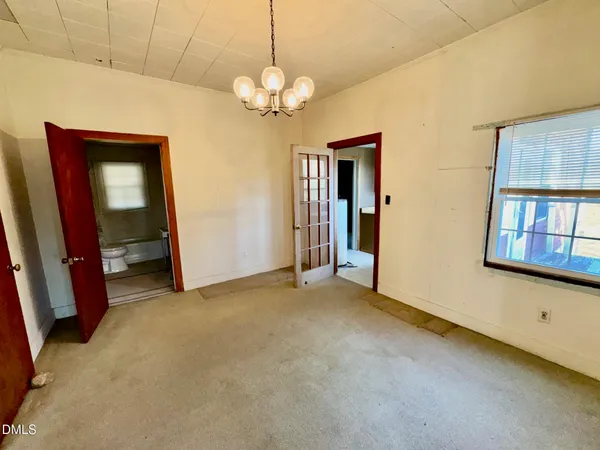 a view of an empty room with a window
