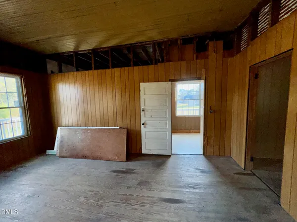 a view of a hallway with furniture and entryway