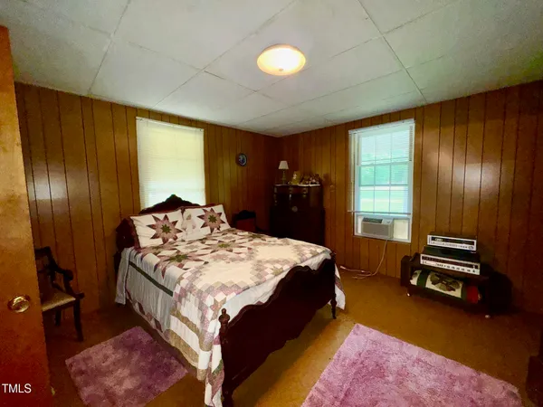 a kitchen with stainless steel appliances kitchen island granite countertop furniture a refrigerator a sink and a stove