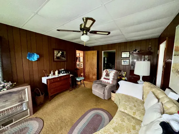 a living room with a couch and a chandelier