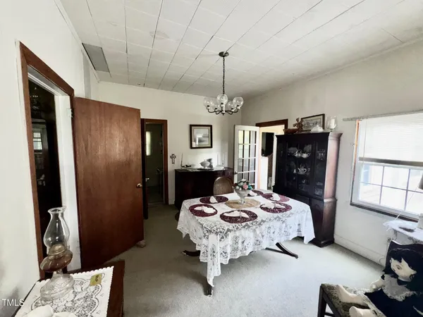 a view of a livingroom with furniture and a window