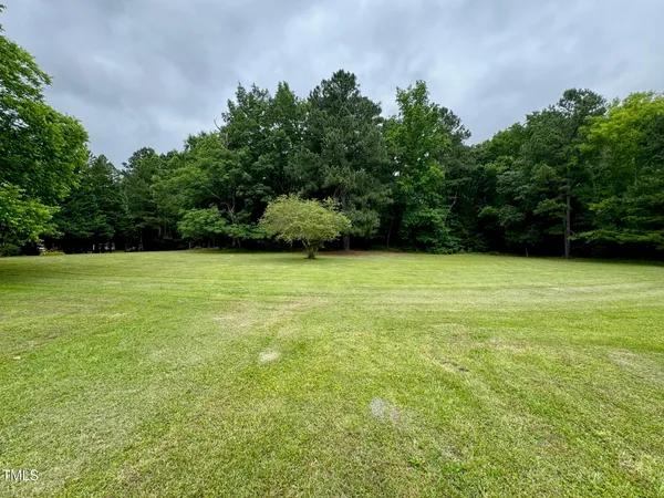 a view of a field with an outdoor space