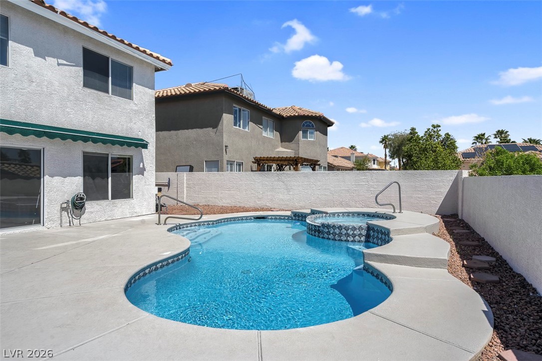 3604 North Campbell Road Las Vegas, NV 89129 - Photo 46 of 54 View of pool with a fenced backyard, a pool with connected hot tub, and a patio