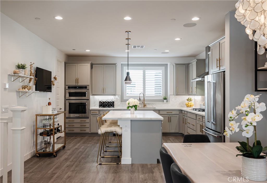 663 Daniel Freeman Circle Inglewood, CA 90301 - Photo 1 of 1 a kitchen with stainless steel appliances kitchen island granite countertop a sink stove and refrigerator