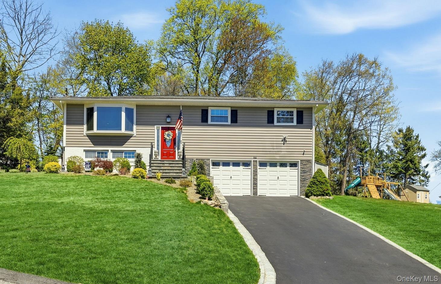 56 Tanager Road Mahopac, NY 10541 - Photo 1 of 30 a front view of house with yard and green space