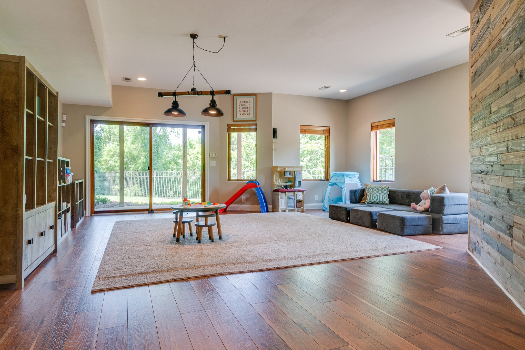809 Aldwych Circle Franklin, TN 37069 - Photo 32 of 44 a living room with furniture a flat screen tv and a large window