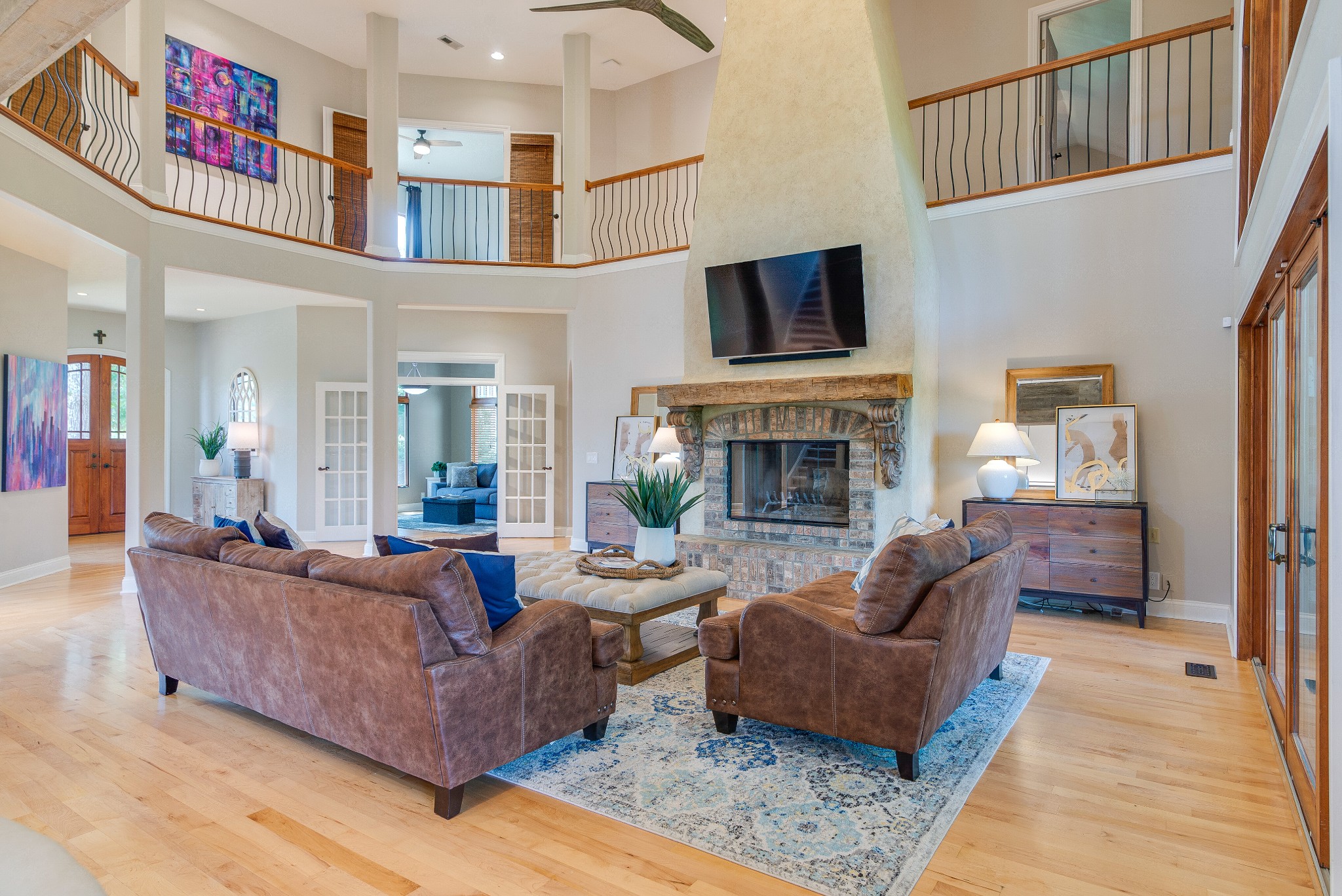 809 Aldwych Circle Franklin, TN 37069 - Photo 7 of 44 a living room with furniture flat screen tv and a fireplace