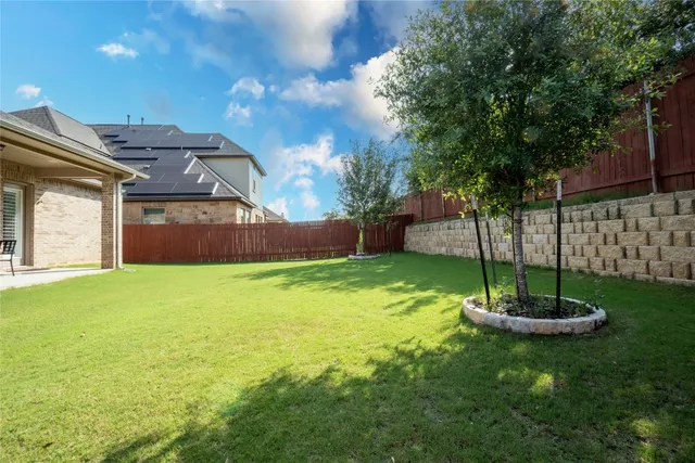 a view of a backyard with a garden