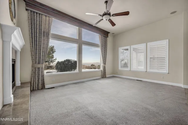 a bathroom with a granite countertop sink a toilet and a mirror