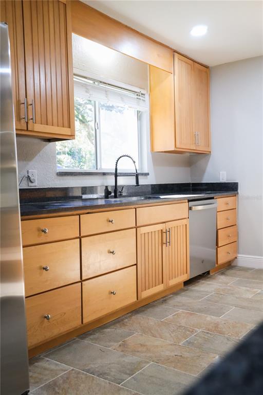 1850 Northwest 35th Street Ocala, FL 34475 - Photo 14 of 24 a kitchen with granite countertop white cabinets and sink