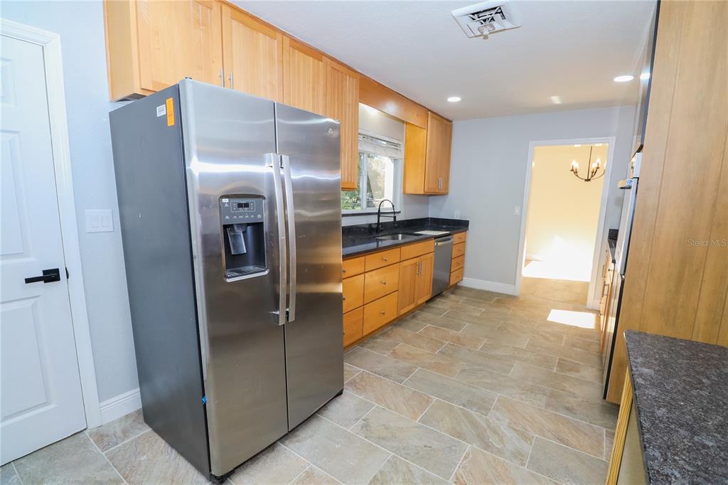 1850 Northwest 35th Street Ocala, FL 34475 - Photo 15 of 24 a kitchen with stainless steel appliances granite countertop a refrigerator and a sink