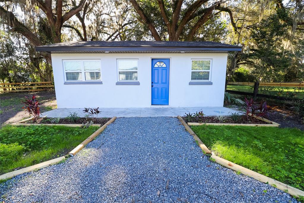 1850 Northwest 35th Street Ocala, FL 34475 - Photo 19 of 24 a front view of a house with garden