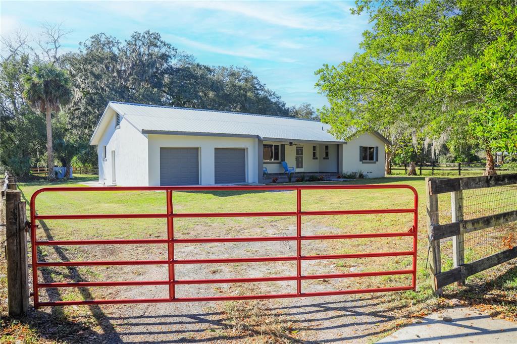 1850 Northwest 35th Street Ocala, FL 34475 - Photo 2 of 24 a front view of a house with a yard