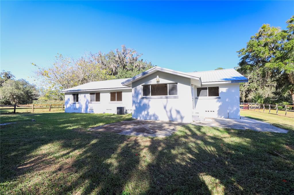 1850 Northwest 35th Street Ocala, FL 34475 - Photo 9 of 24 a front view of a house with a garden