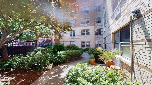 a view of a backyard with garden