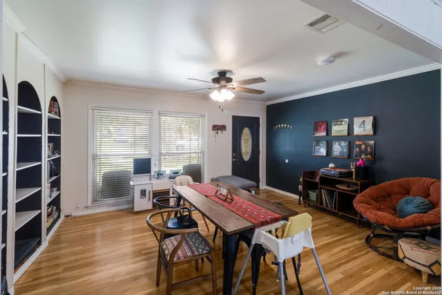 a view of a dining room with furniture window and wooden floor