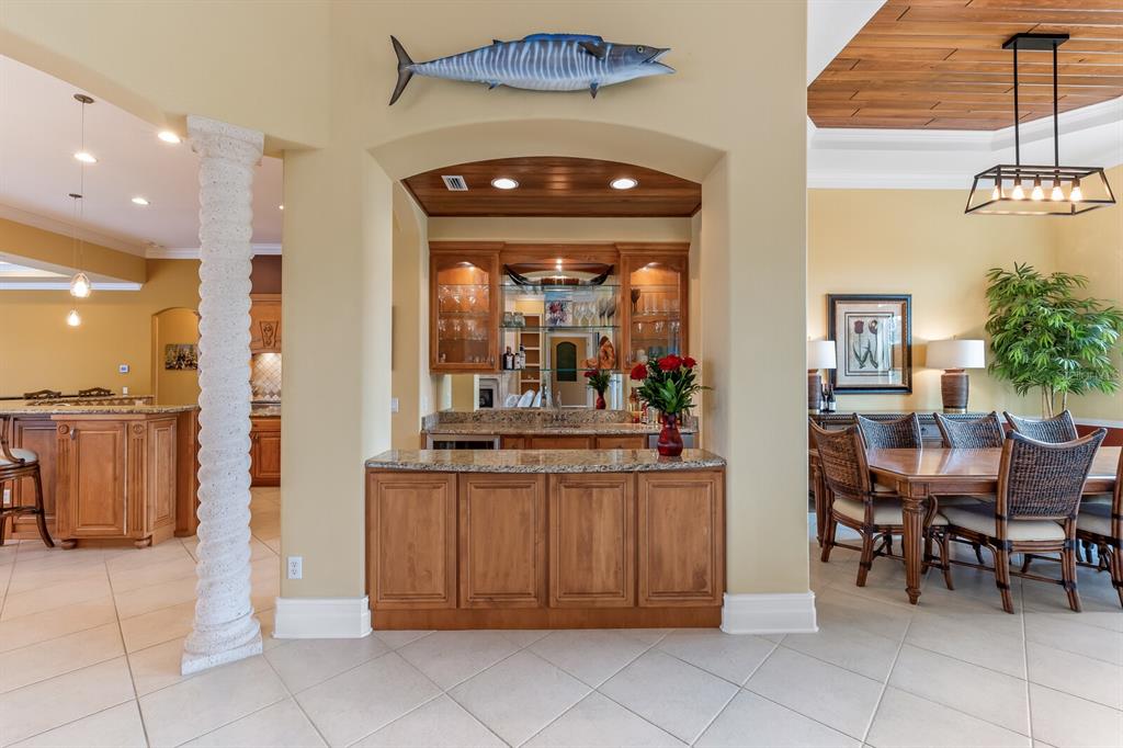 3700 Como Street Port Charlotte, FL 33948 - Photo 14 of 88 a view of a dining room with furniture and a chandelier