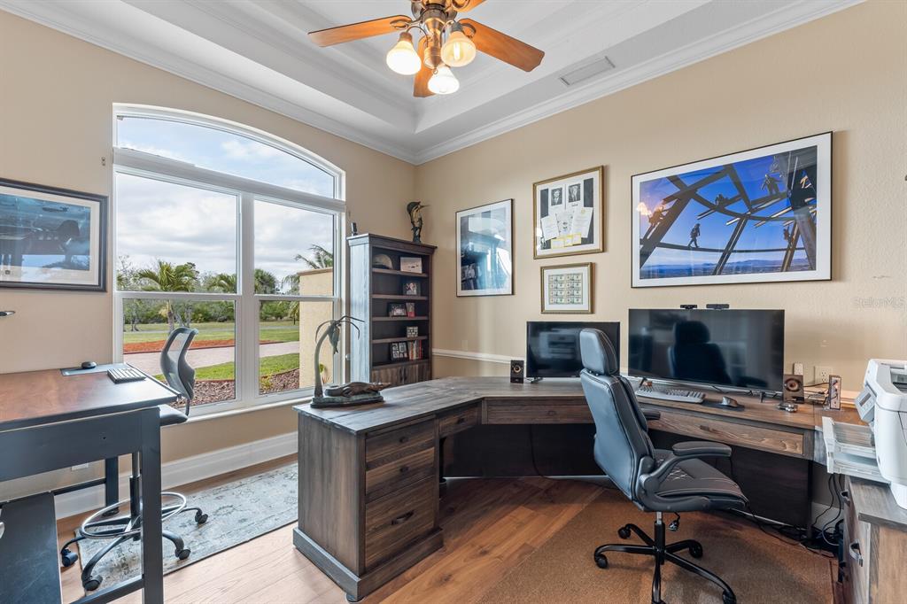 3700 Como Street Port Charlotte, FL 33948 - Photo 23 of 88 a view of a workspace with furniture and a window