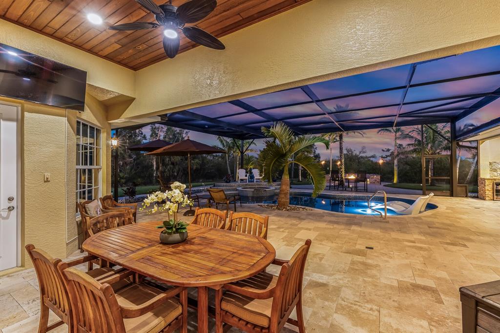 3700 Como Street Port Charlotte, FL 33948 - Photo 27 of 88 a view of a patio with a table and chairs under an umbrella