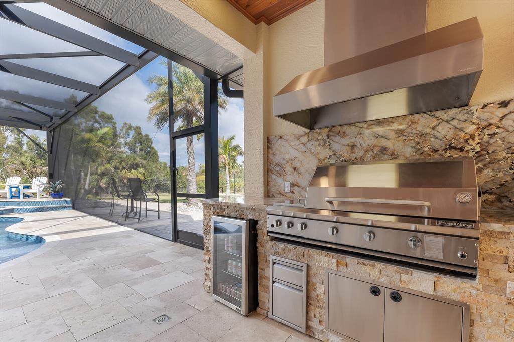 3700 Como Street Port Charlotte, FL 33948 - Photo 28 of 88 a kitchen with stainless steel appliances granite countertop a stove a sink and a microwave