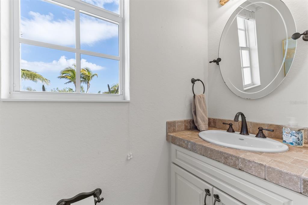 3700 Como Street Port Charlotte, FL 33948 - Photo 34 of 88 a bathroom with a sink and a mirror