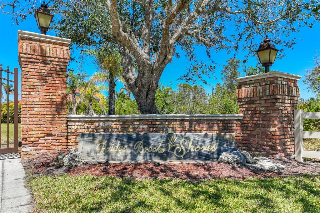 3700 Como Street Port Charlotte, FL 33948 - Photo 4 of 88 a view of a brick wall with a tree in the background