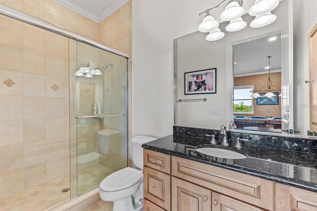 3700 Como Street Port Charlotte, FL 33948 - Photo 42 of 88 a bathroom with a granite countertop sink a toilet and a mirror