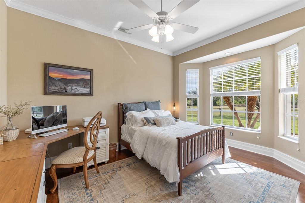 3700 Como Street Port Charlotte, FL 33948 - Photo 43 of 88 a bedroom with a bed table chair and a window