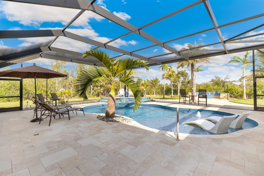 3700 Como Street Port Charlotte, FL 33948 - Photo 68 of 88 a view of a swimming pool with chairs in patio