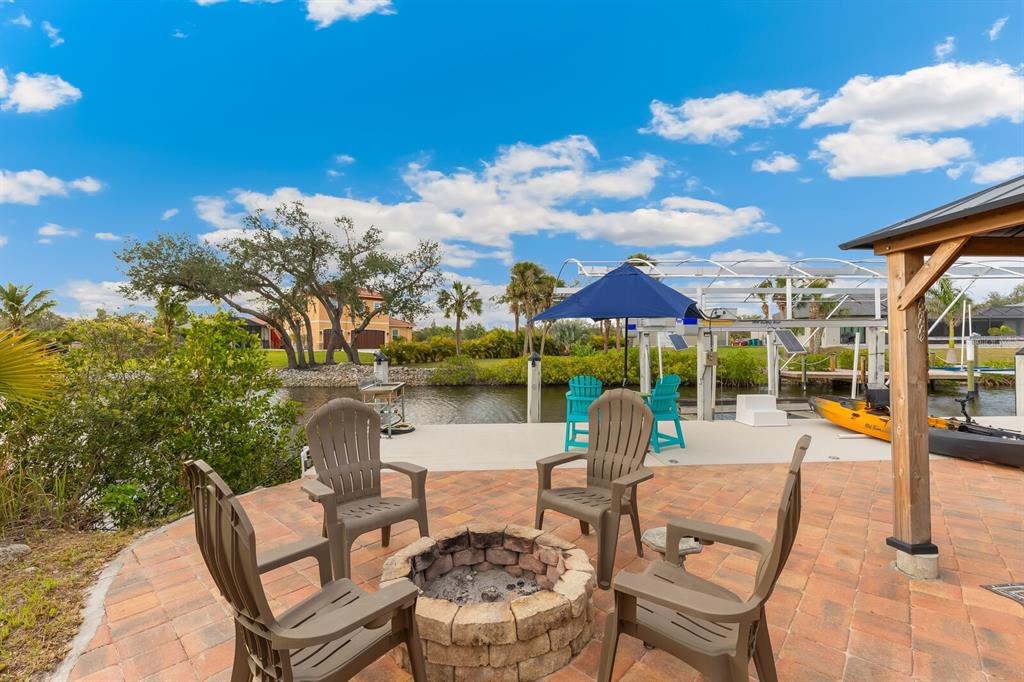 3700 Como Street Port Charlotte, FL 33948 - Photo 78 of 88 a view of a swimming pool with a lounge chairs