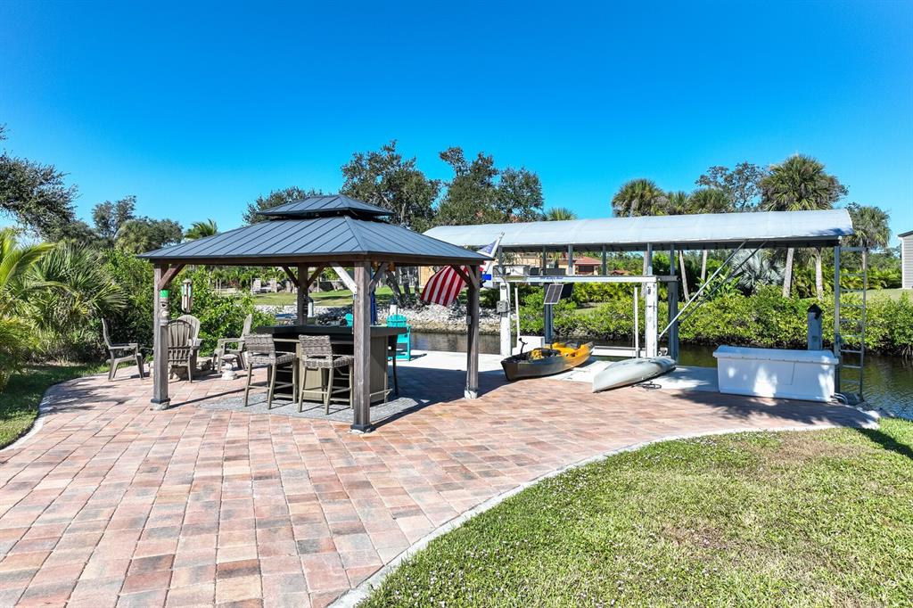 3700 Como Street Port Charlotte, FL 33948 - Photo 87 of 88 a view of outdoor space yard deck patio and outdoor kitchen