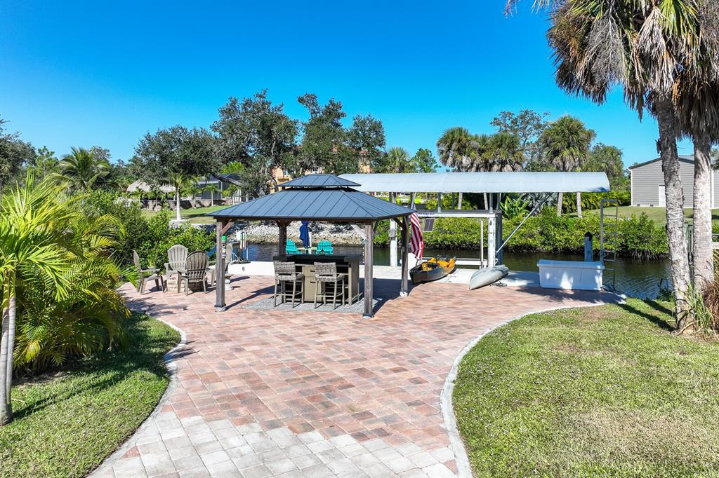 3700 Como Street Port Charlotte, FL 33948 - Photo 88 of 88 a view of a backyard with a sitting area and furniture