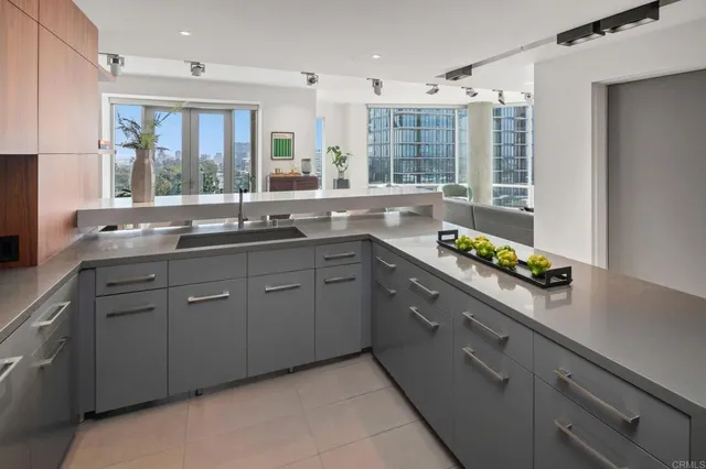a kitchen with a sink stove and window