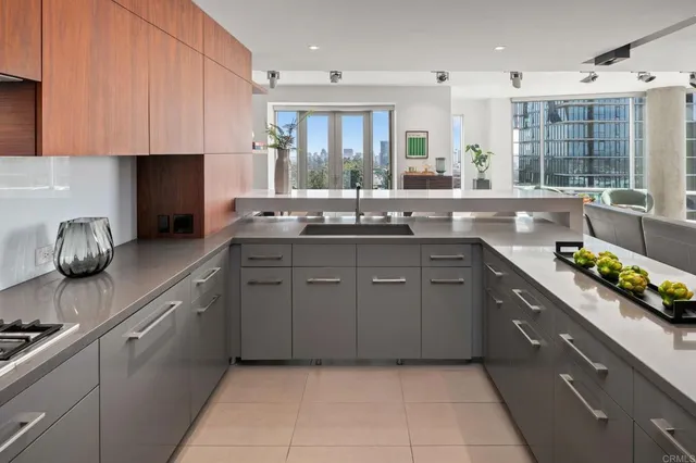 a kitchen with a sink and cabinets