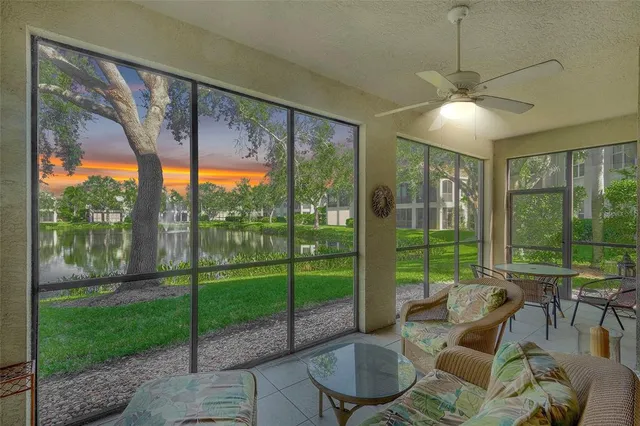 a living room with patio area and balcony view