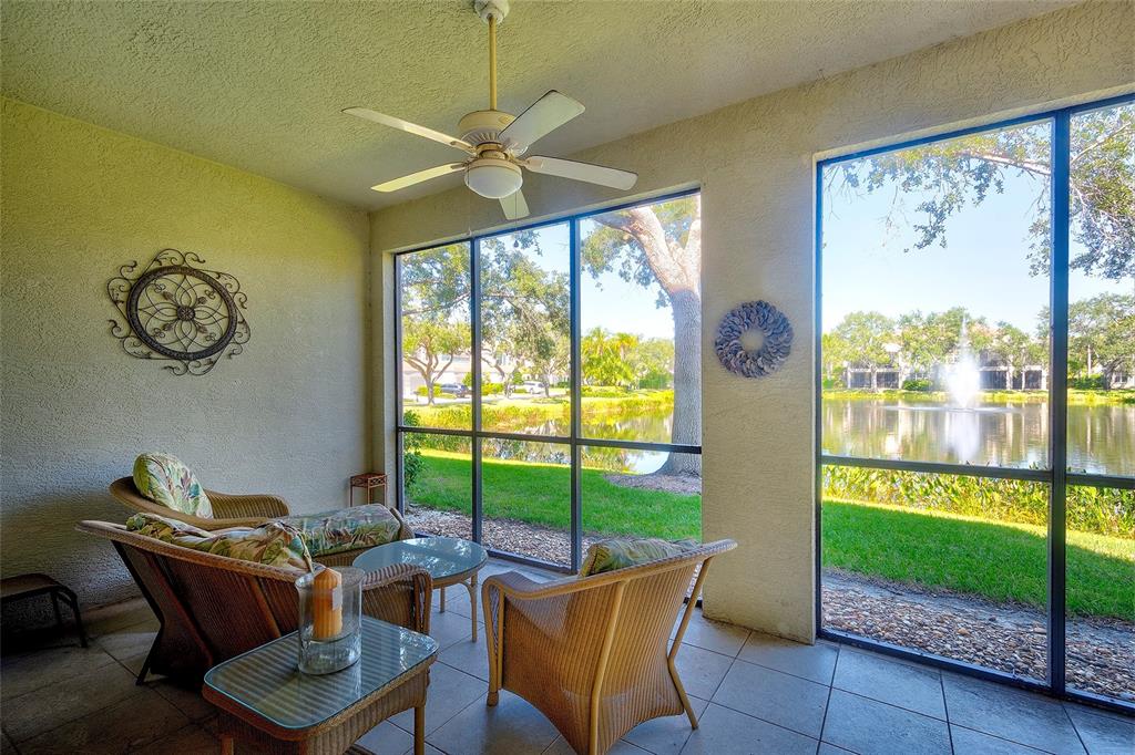 5264 Bouchard Circle, Unit 102 Sarasota, FL 34238 - Photo 20 of 32 a living room with furniture and a large window